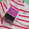 The image shows a clothing stamp from the Avery brand, placed on a red and white striped t-shirt. The stamp is designed to mark garments with the text 'Clothing Stamp'.