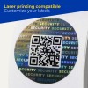 Round holographic security sticker with QR code and repeating "SECURITY" text
