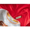 The image shows two clothing items: a gray sweatshirt with the name tag 'Alice D' and a red jacket with the name tag 'Mathieu A'.