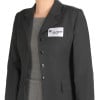 The image shows a person in a black blazer with a gray underskirt. On the blazer, there is a name tag with the text 'Julia SMITH Marketing'.
