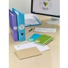 The image shows a desk with folders, envelopes, a monitor, and a keyboard. The folders are of various colors and are labeled.