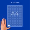 Hand next to an A4 grid sheet labeled 20 x 20 mm with small square cells