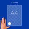 Hand next to A4 sheet with 40 mm circular stickers grid, one white sticker shown