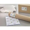 The image shows a few letters with addresses, labels, and a roll of packaging material, all associated with the company 'Abstract Architecture'.