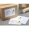 The image features cardboard boxes with address labels. One box is labeled with a name and address, and there are printed sheets with additional names and addresses, alongside a cylindrical object and a sheet with design elements. The branding 'ABSTRACT Architecture' is visible on the labels and sheets.