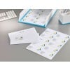 The image shows stationery, an envelope, and an organizer, all with the same company logo and address labels. The design is modern and stylized, with a color palette of blue and yellow.