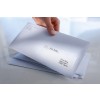 The image shows a hand holding a business envelope with a label. There are multiple envelopes stacked underneath. One envelope is addressed to Anna Berg in Berlin with a company name 'Mark Binder' visible.