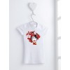 A white T-shirt hanging on a hanger, displaying an artistic design of a female face surrounded by flowers.