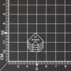 The image shows a grid background with a graphic indicating a stack of 30 sheets. The stacks are depicted with diagonal lines, emphasizing the amount. The grid is measured in centimeters, with markings along the edges.