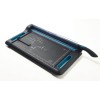 This is a paper cutter or cutting machine with a black and blue design, equipped with a cutting plate with a grid. The device has a handle and a protective cover.