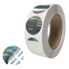 Roll of round holographic security VOID stickers on white backing