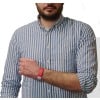 The image shows a person wearing a striped shirt with a red wristband on their arm. They are holding their arm in a way that the wristband is visible, and the background is plain white.