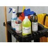 The image features a cleaning cart with various cleaning supplies. It includes sprayers, bottles of chemicals, a mop handle, and a bucket, all organized neatly for cleaning tasks.
