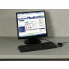 The image shows a computer monitor displaying a design and print interface for labeling products, featuring a focus on a polyurethane coating with hazard symbols and editing options. A keyboard and mouse are also visible on the desk.